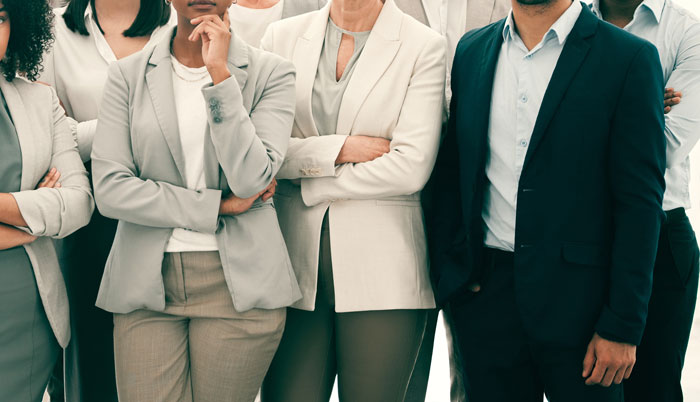 Group of serious family members standing with arms crossed during a tense family intervention scene. Group of serious family members standing with arms crossed during a tense family intervention scene.