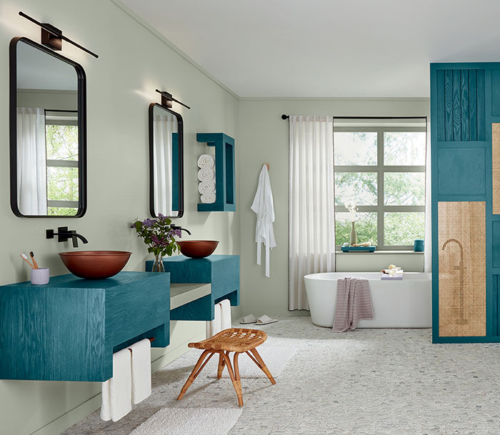 Bright bathroom featuring Bay Blue wood stain colors on vanities and cabinetry with natural light and modern design. Bright bathroom featuring Bay Blue wood stain colors on vanities and cabinetry with natural light and modern design.