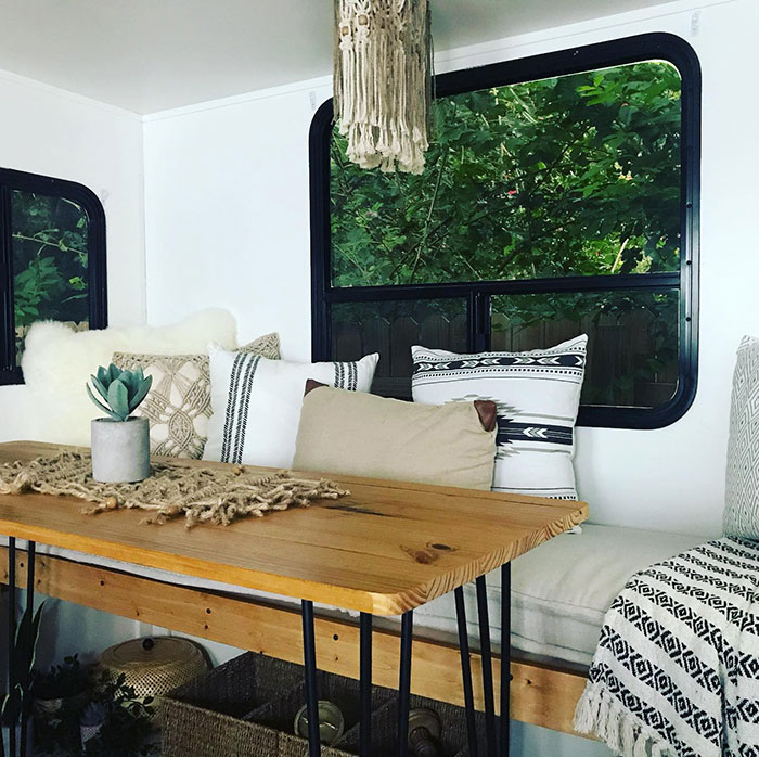 Early American style wooden table with Minwax stain colors in a cozy room featuring decorative pillows and natural light. Early American style wooden table with Minwax stain colors in a cozy room featuring decorative pillows and natural light.