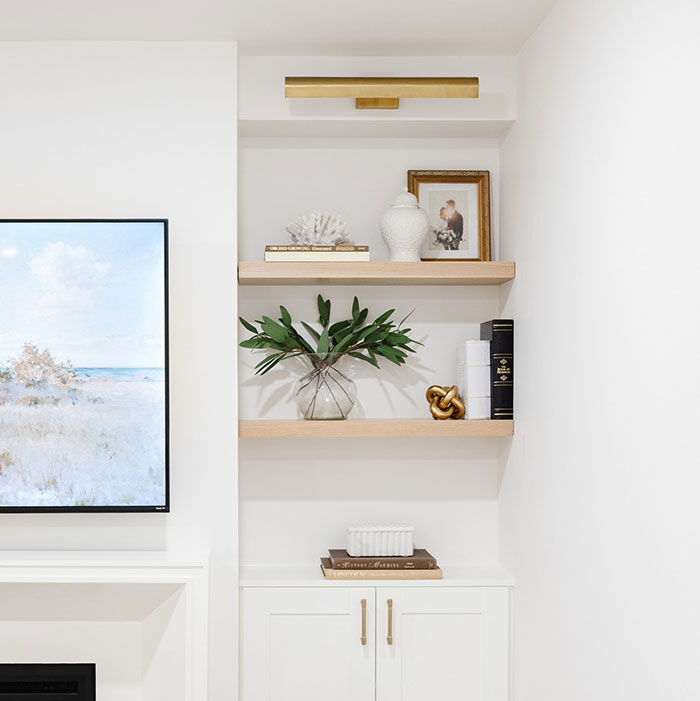 Pickled Oak Minwax stain color on wooden shelves in a modern white room corner with decorative items. Pickled Oak Minwax stain color on wooden shelves in a modern white room corner with decorative items.