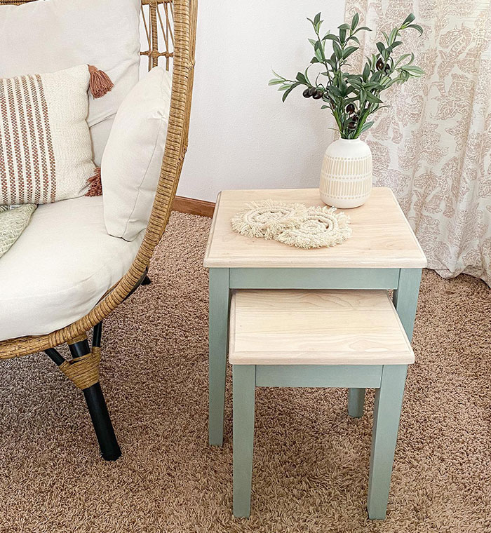 Simply white wood stain colors shown on small nested tables in a cozy living room setting with decorative vase and cushions. Simply white wood stain colors shown on small nested tables in a cozy living room setting with decorative vase and cushions.