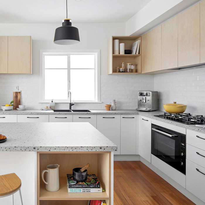 Multiple different wood tones in a bright kitchen 
