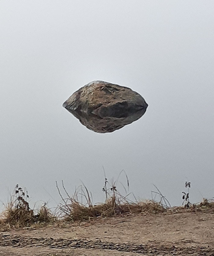This Rock Is Just Reflecting In Water That You Can't See Because Of The Fog