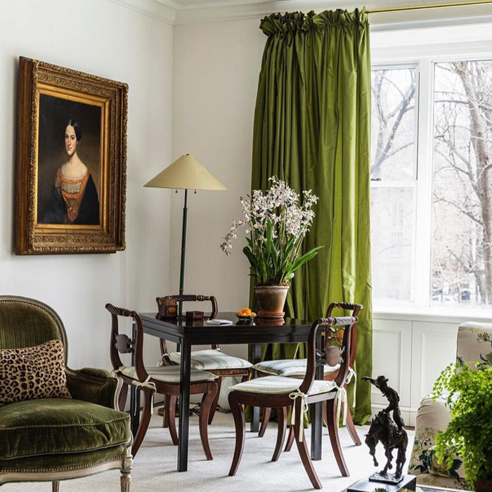 Room with green curtains, wooden furniture, and classic decor showcasing old money interior design style and elegance. Room with green curtains, wooden furniture, and classic decor showcasing old money interior design style and elegance.