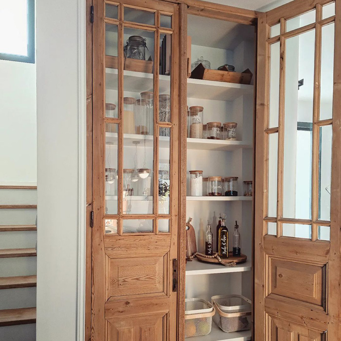 Opened wooden pantry door
