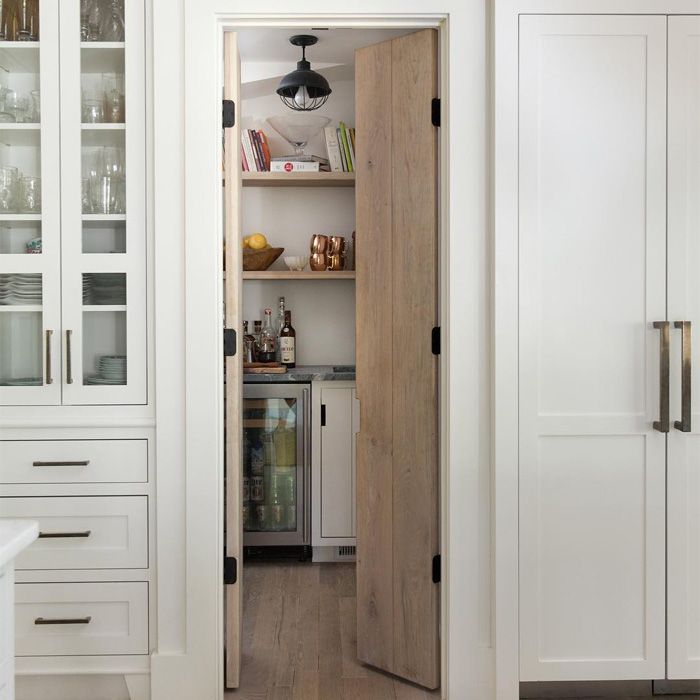 A pantry on the kitchen with groceries inside A pantry on the kitchen with groceries inside