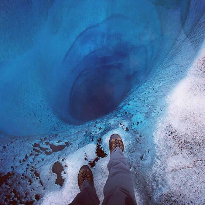 Staring Down What Could Be A 1,000-Ft-Deep Wormhole Through The Blue Ice Of The Lower Ruth Glacier