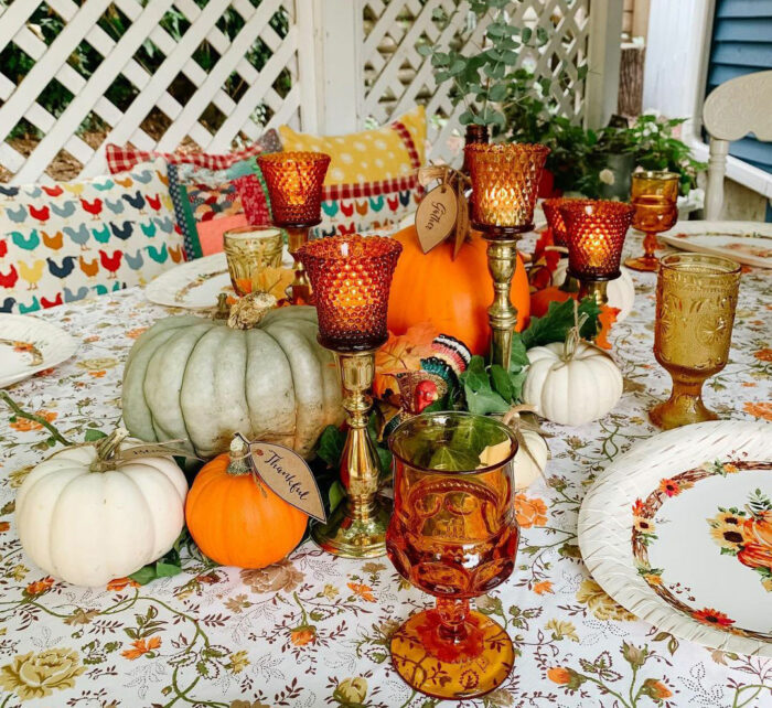Big and small pumpkins in the center of the table