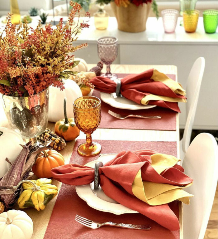 Red and yellow napkins on plates