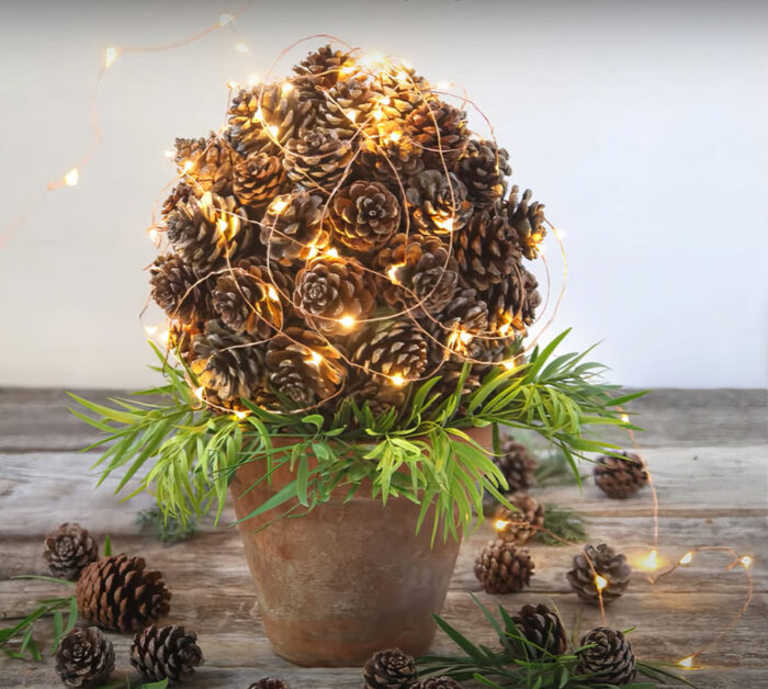 Pine cone topiary with garland