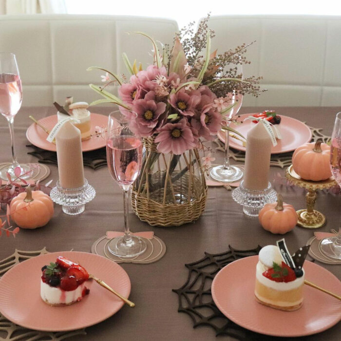 Pink flowers and plates on dining table