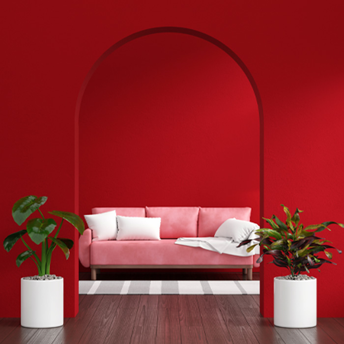 Pink sofa in red living room