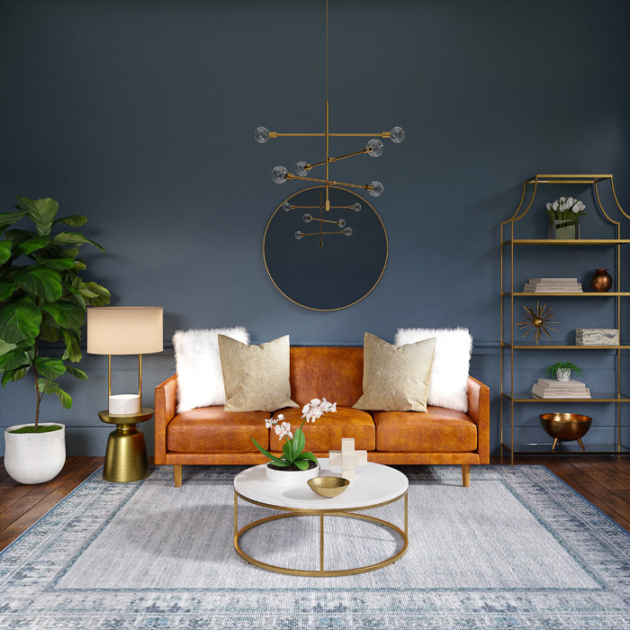 Brown couch with warm colors accented by pillows and a round coffee table in a stylish modern living room decor. Brown couch with warm colors accented by pillows and a round coffee table in a stylish modern living room decor.