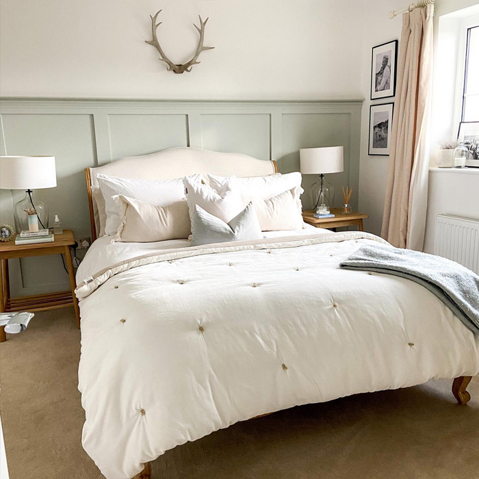 Bedroom with mint walls and white bed featuring pillows, showcasing warm colors decor ideas for a cozy and inviting space. Bedroom with mint walls and white bed featuring pillows, showcasing warm colors decor ideas for a cozy and inviting space.