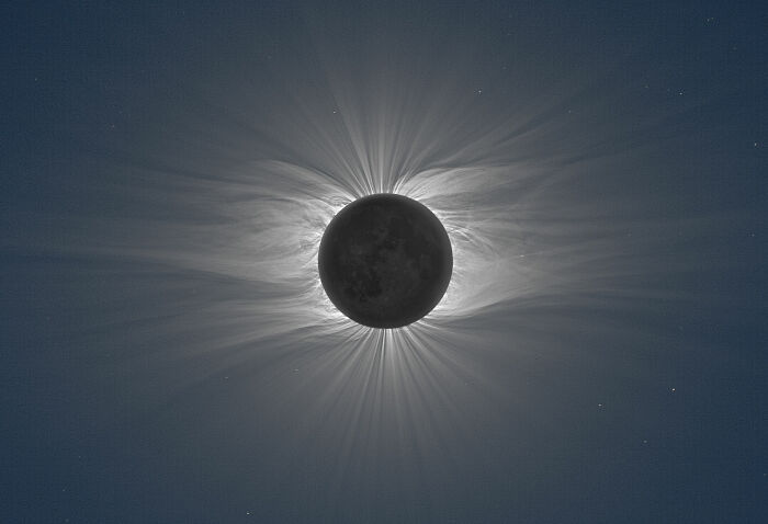 The Moon During A Total Solar Eclipse Revealing A Vast Solar Corona