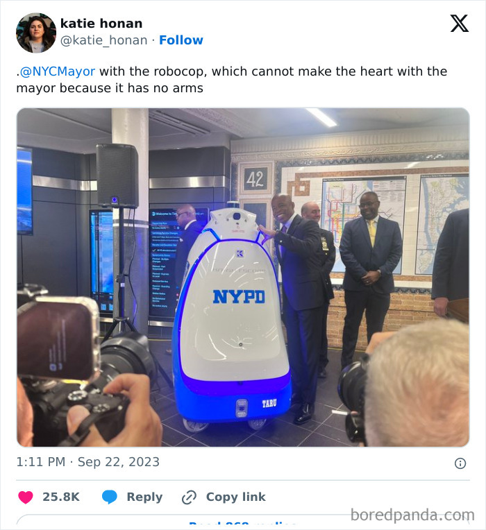 Nycmayor With The Robocop, Which Cannot Make The Heart With The Mayor Because It Has No Arms
