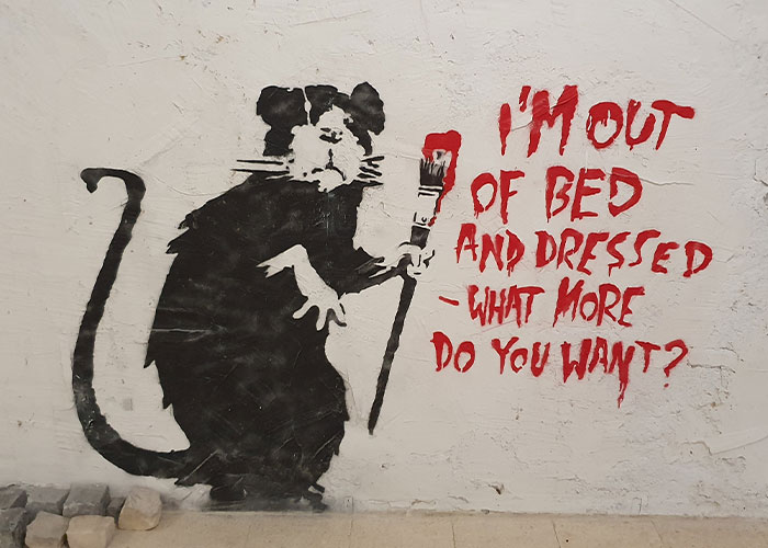 Banksy Fans Stunned As Artist “Confirms” Name In Resurfaced Interview Banksy Fans Stunned As Artist “Confirms” Name In Resurfaced Interview