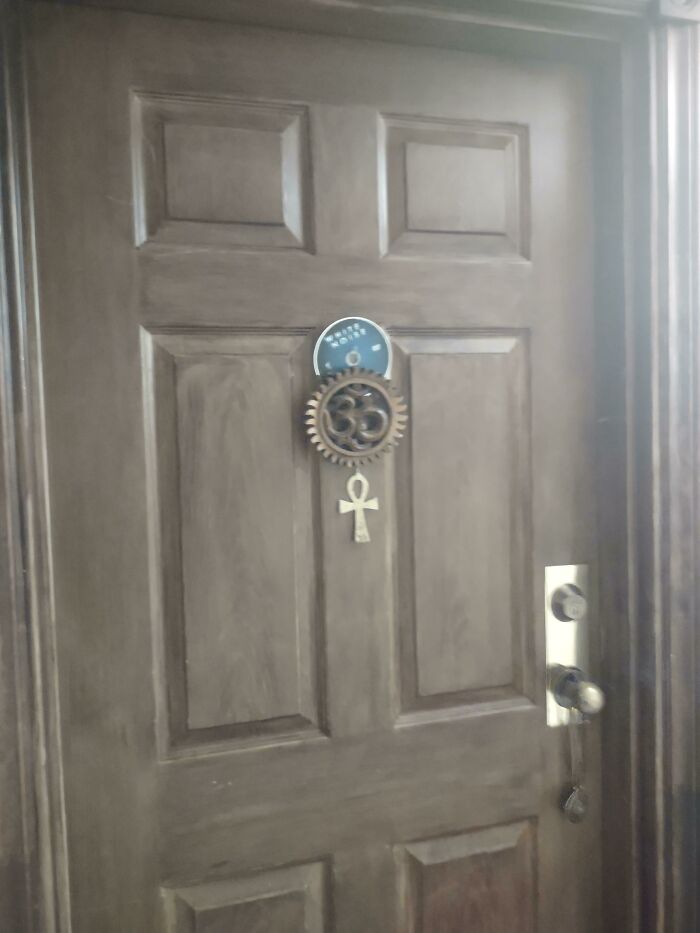 Why Does My Neighbor Have An Ankh, An Om And A White Noise Dvd On Their Apartment Door?