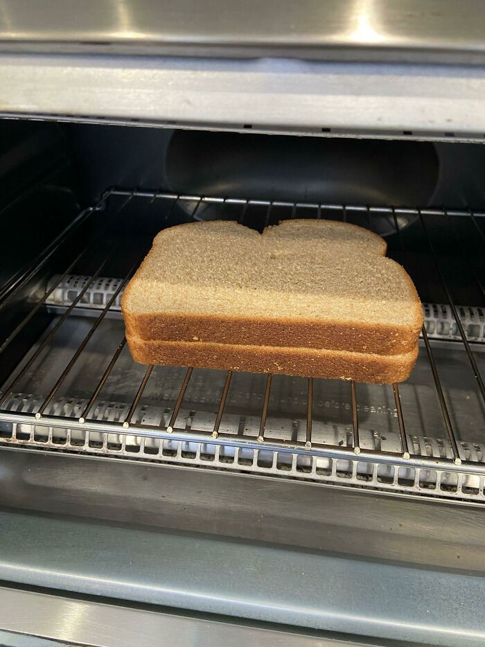 Place Two Slices Of Bread On Top Of Each Other In A Toaster Oven For A Sandwich With Crispy Outside And Warm Inside