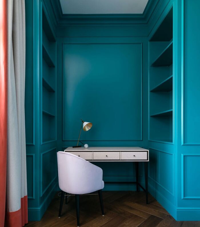 Interior with blue color wainscoting and shelving