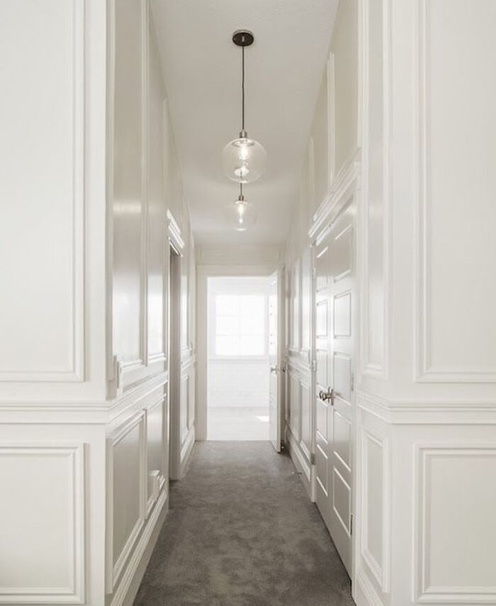 Hallway with white high-gloss wainscoting