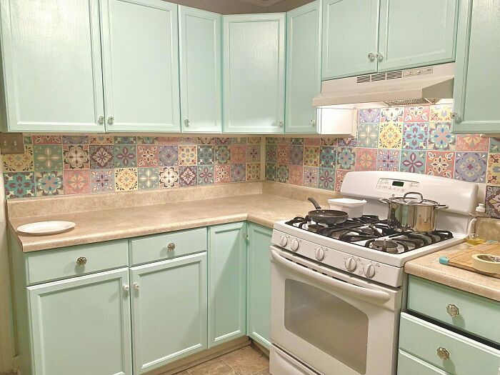 Retro light green kitchen with cabinets