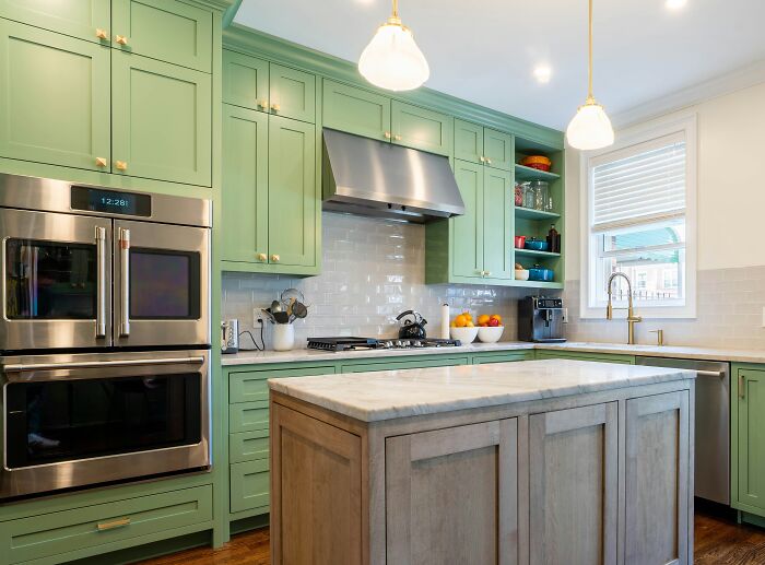 Mint green kitchen with green cabinets