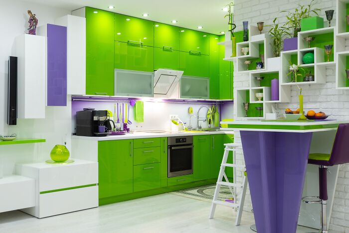 Green and white kitchen with green cabinets