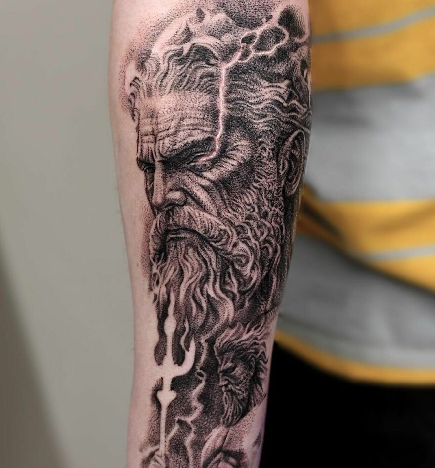 Super realistic tattoo of Poseidon, showcasing intricate detailing on an arm.