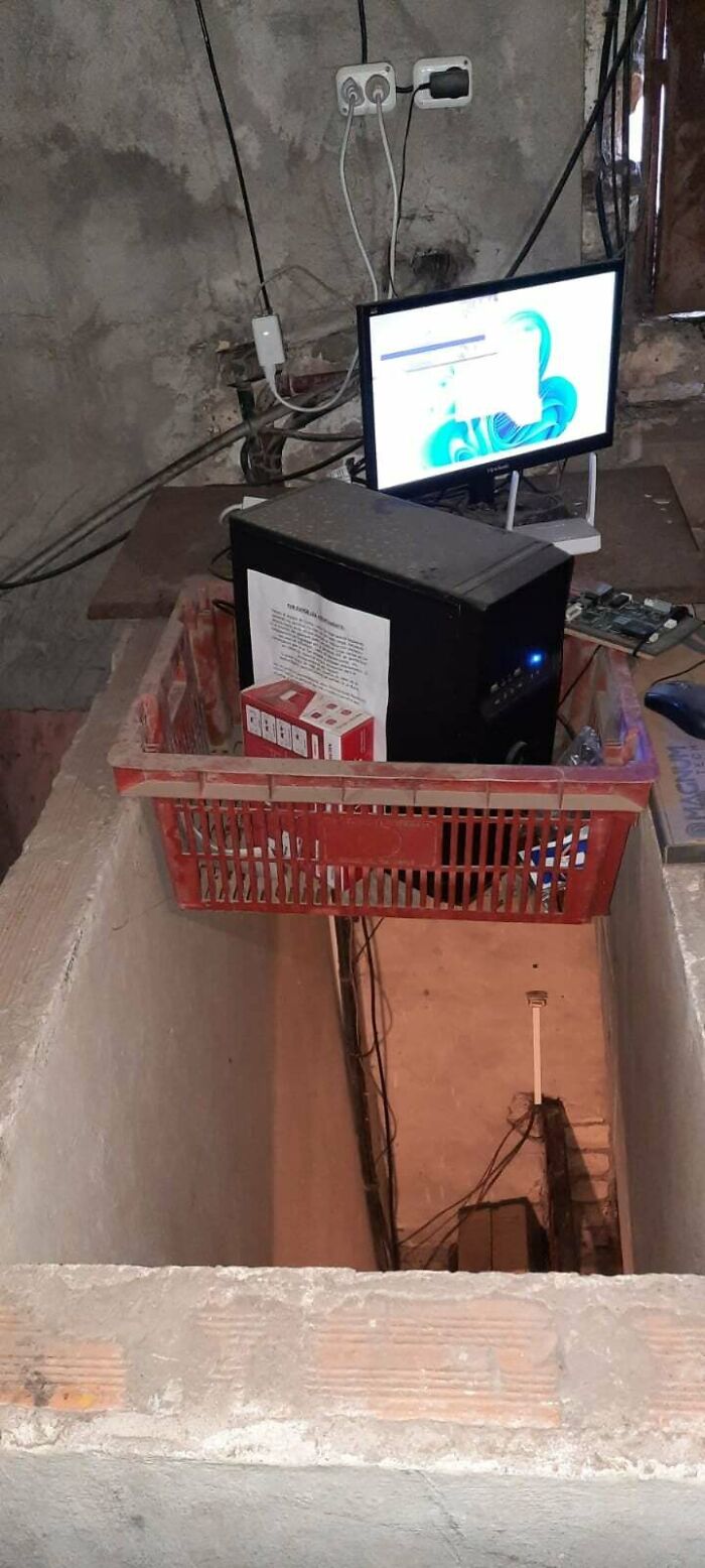 PC Suspended In Staircase Hole