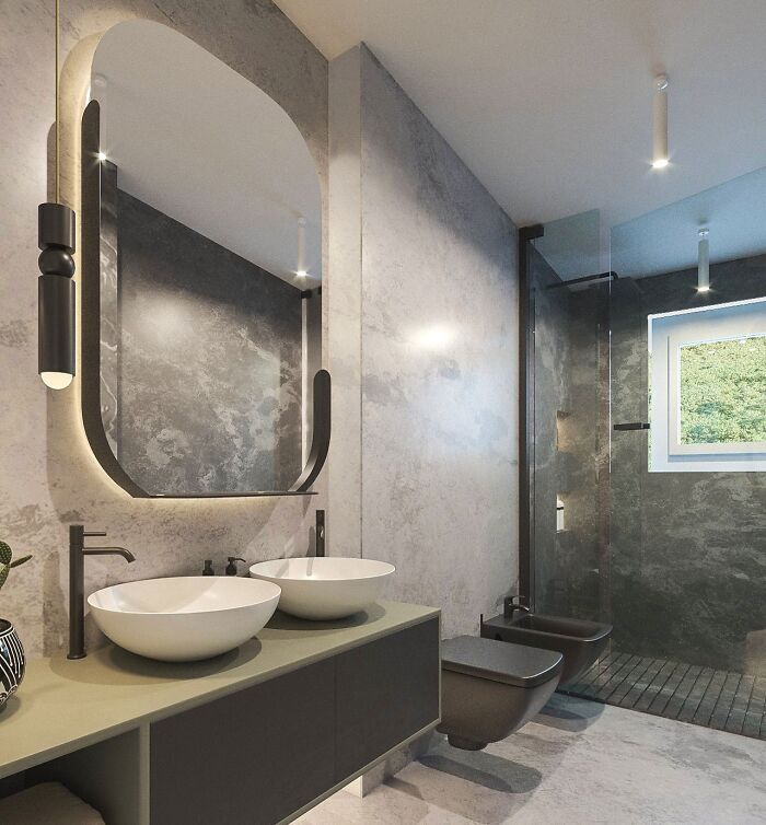 Bathroom with gray tiles and big mirror