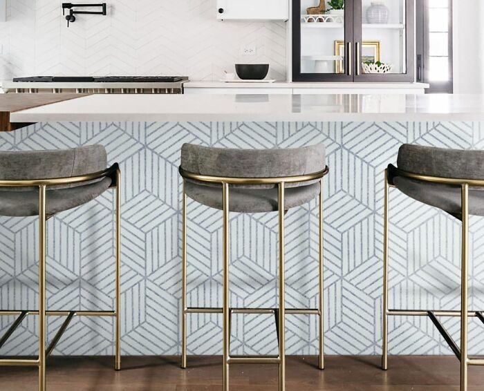 Kitchen with geometric wallpaper and chairs