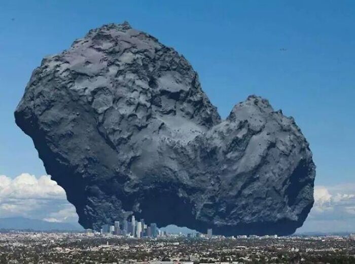 Picture Of Comet 67p/Churyumov–gerasimenko With A City For Scale