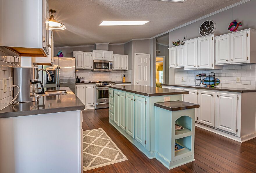 turquoise kitchen island cabinet in the kitchen in white color