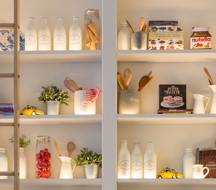 Shelves with different kitchen appliances 