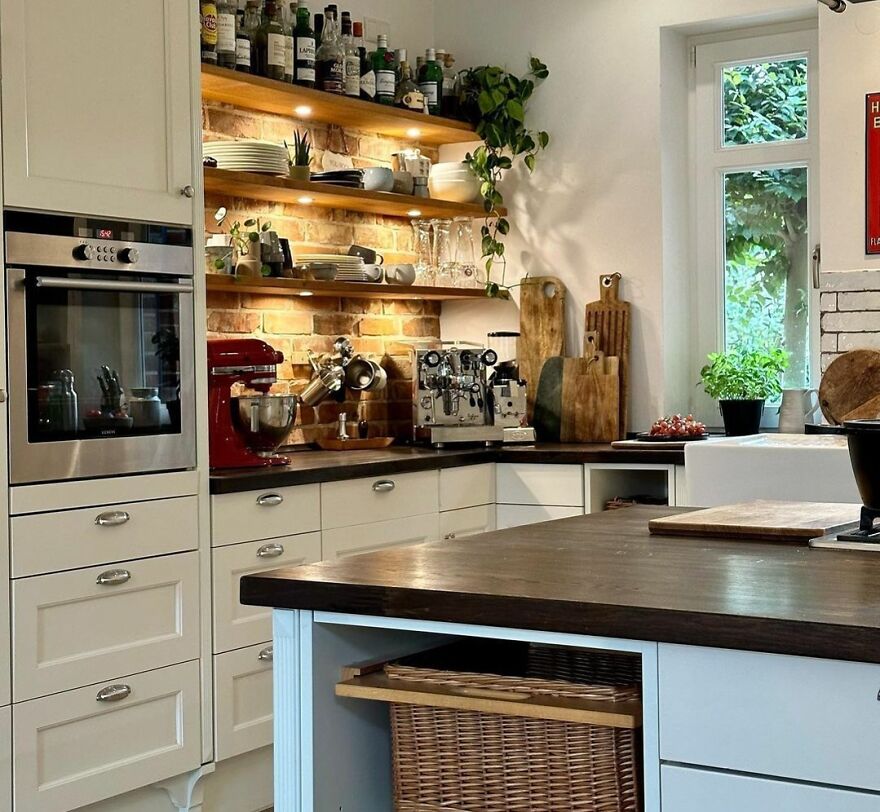 Wooden open shelves with kitchen items