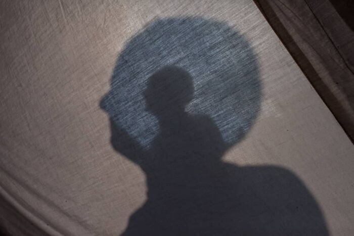 A Photograph Of A Man's Shadow