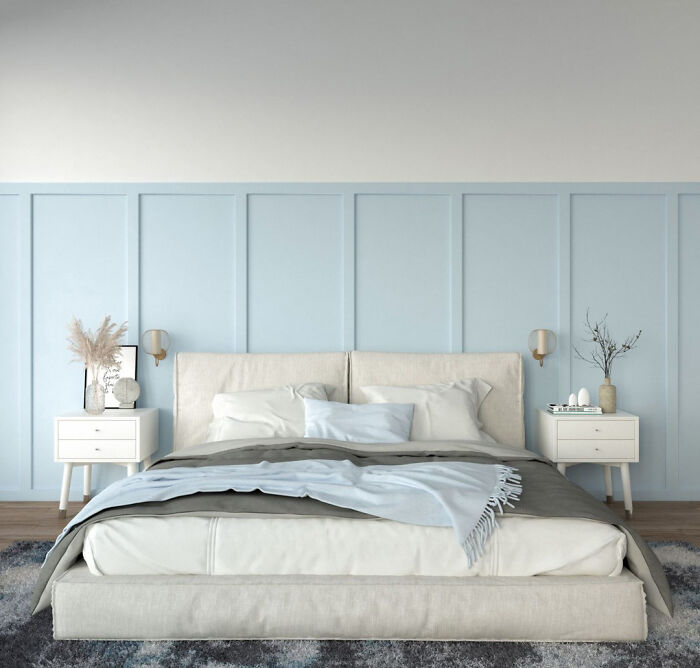 Bedroom with white walls and pastel blue wainscoting