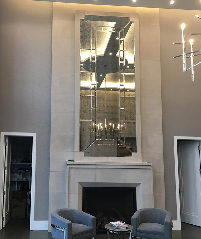 Massive antique mirror on the fireplace mantel 
