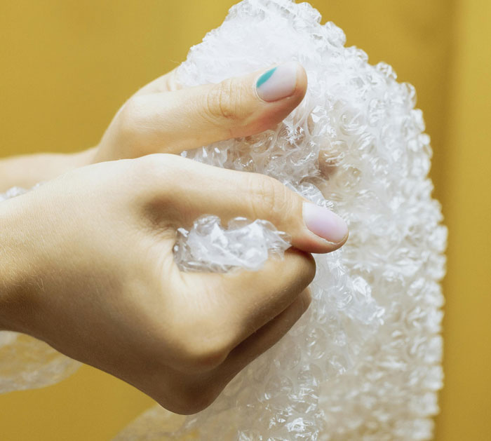Person Popping bubble wrap
