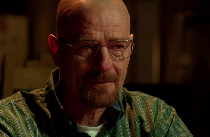 Walter White wearing green shirt looking from Breaking Bad