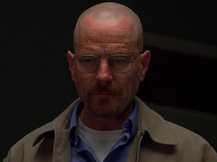 Walter White wearing gray jacket looking from Breaking Bad