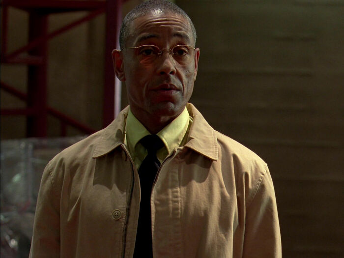 Gus wearing brown jacket and looking from Breaking Bad