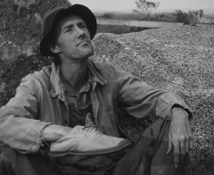 Tom Joad sitting in The Grapes of Wrath