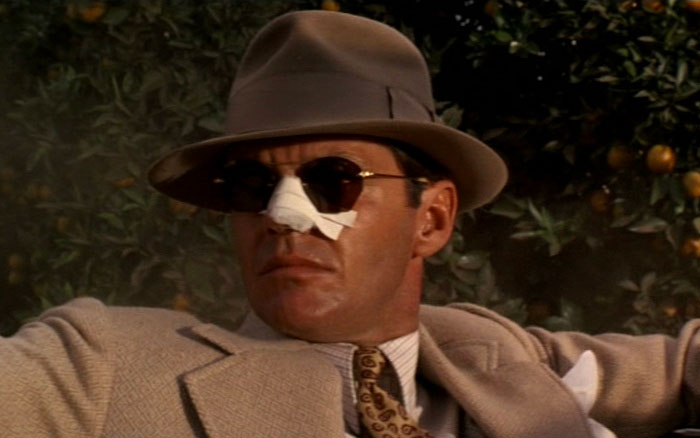 J.J. Gittes sitting and looking in Chinatown