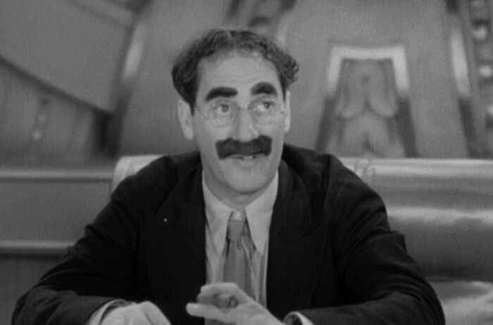 Rufus T. Firefly sitting and talking in Duck Soup