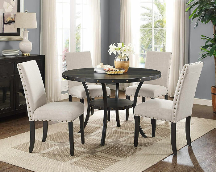 Dining room with white chairs and black table showcasing inspiring dining room ideas for family gatherings and parties.
