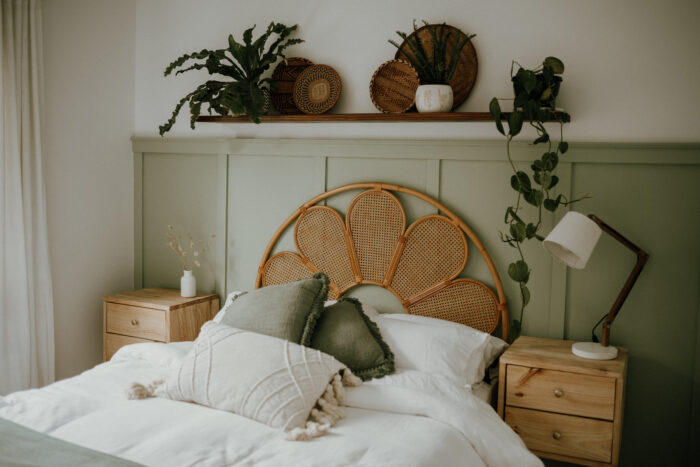 Pillows on the bed with rattan headboard