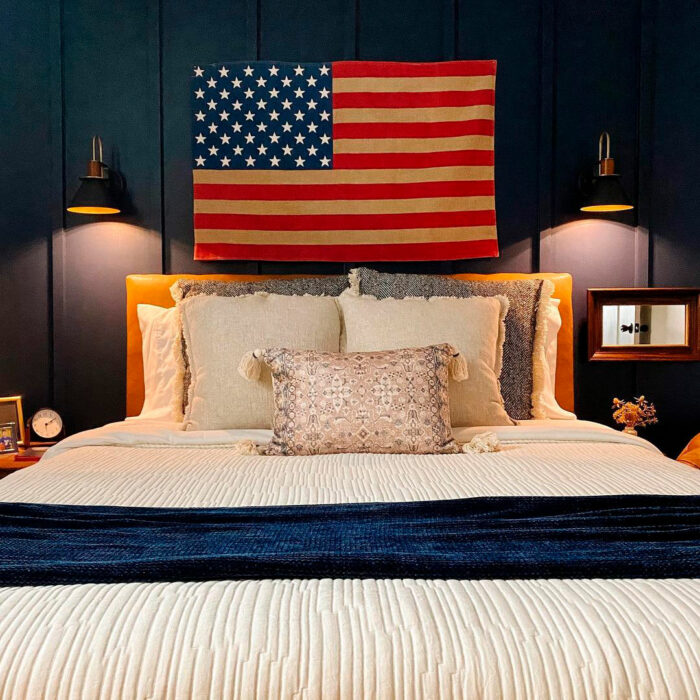 Flag hanging on the wall near the bed