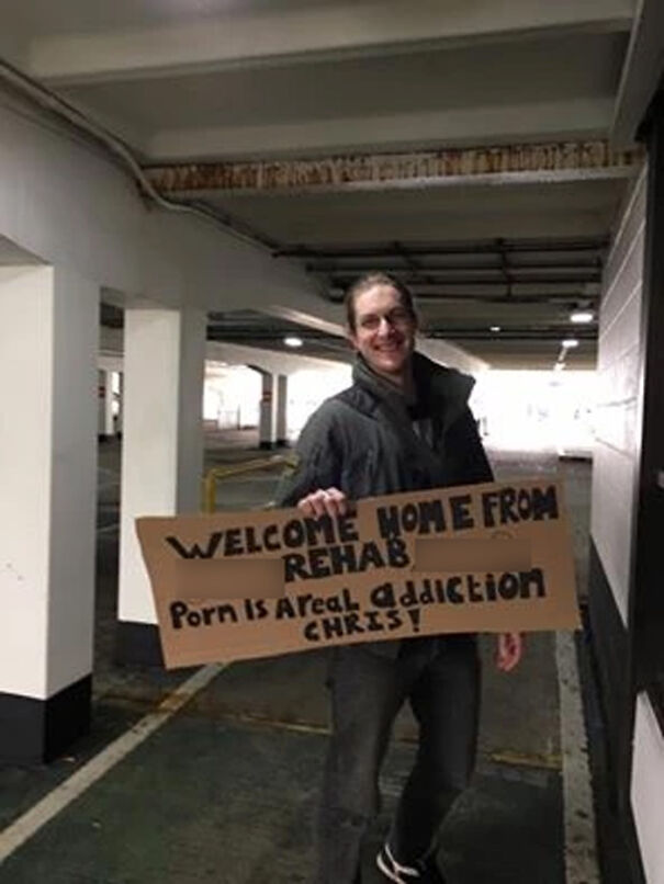Man holding a welcome sign 